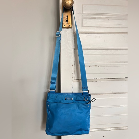 Tumi Handbags - 💙 Tumi Voyager Crossbody Bag - turquoise blue